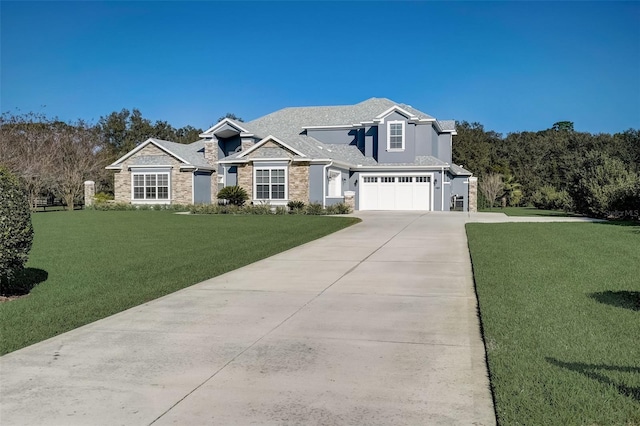 view of front of property with a front yard and a garage