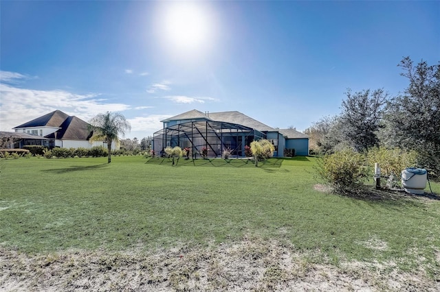 view of yard with glass enclosure