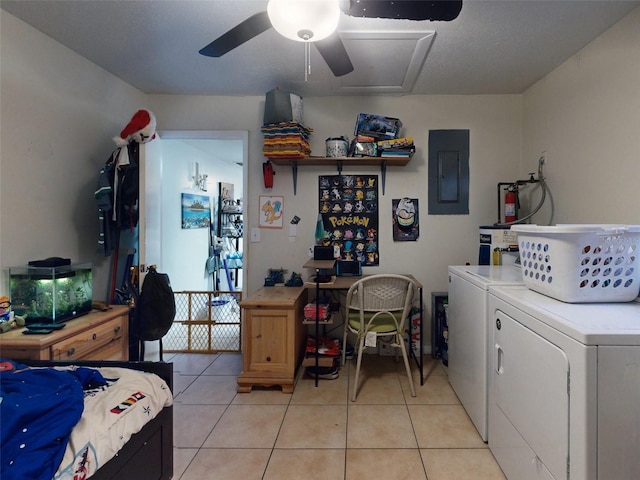 interior space featuring light tile floors, independent washer and dryer, and ceiling fan