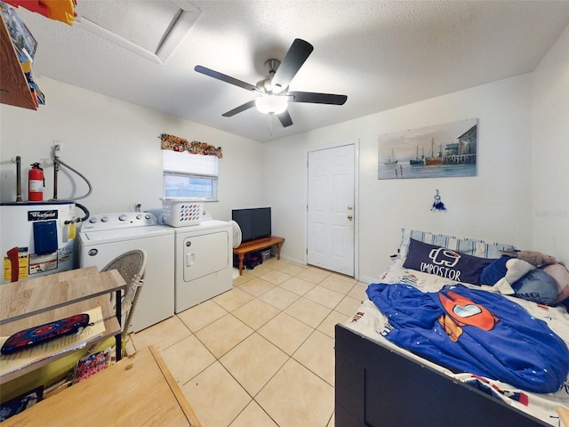 laundry room with ceiling fan, light tile floors, washer and clothes dryer, a textured ceiling, and electric water heater