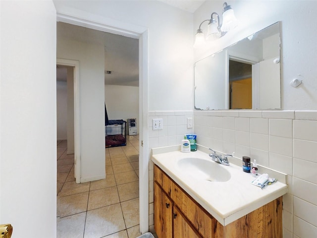 bathroom featuring tile flooring, backsplash, large vanity, and tile walls