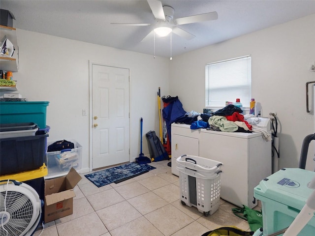 laundry room featuring light tile flooring, washing machine and dryer, and ceiling fan