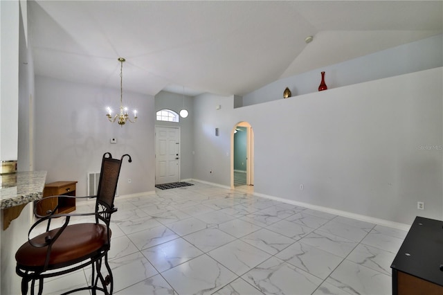 dining room with an inviting chandelier, high vaulted ceiling, and light tile flooring