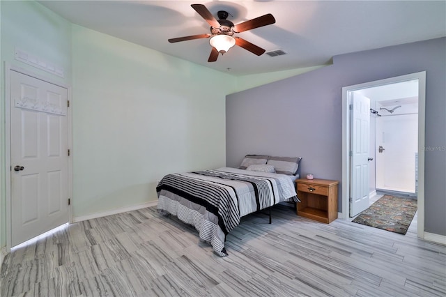 bedroom with lofted ceiling, light hardwood / wood-style floors, and ceiling fan