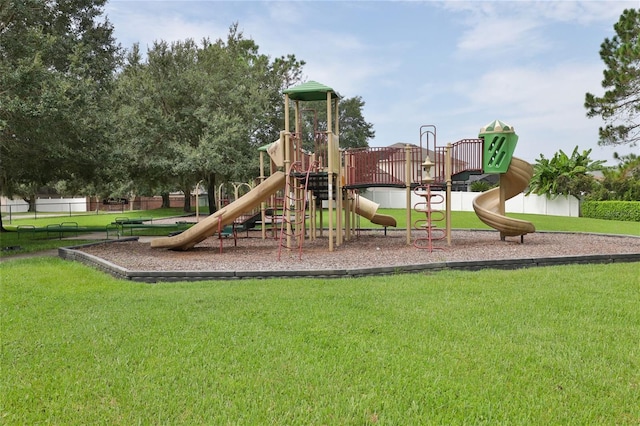 view of playground with a lawn