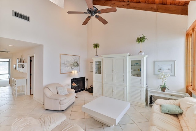 4875 S Atlantic Ave Unit E, New Smyrna Beach, FL 32169 - living room featuring high vaulted ceiling, beam ceiling, and ceiling fan