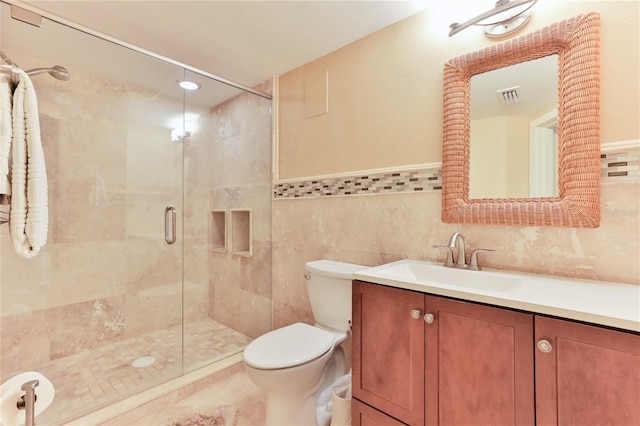 4875 S Atlantic Ave Unit E, New Smyrna Beach, FL 32169 - bathroom with tile walls, oversized vanity, toilet, and backsplash