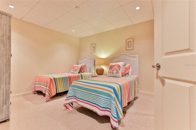 4875 S Atlantic Ave Unit E, New Smyrna Beach, FL 32169 - carpeted bedroom with a drop ceiling