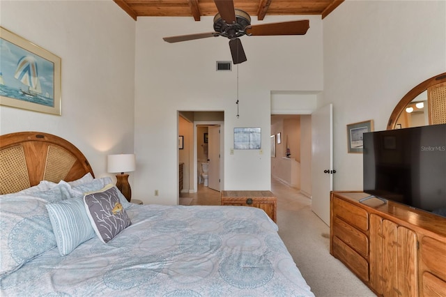4875 S Atlantic Ave Unit E, New Smyrna Beach, FL 32169 - carpeted bedroom with a towering ceiling, wood ceiling, ceiling fan, and beamed ceiling
