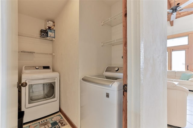 4875 S Atlantic Ave Unit E, New Smyrna Beach, FL 32169 - laundry area with light tile floors, separate washer and dryer, and ceiling fan