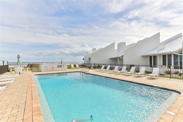4875 S Atlantic Ave Unit E, New Smyrna Beach, FL 32169 - view of swimming pool featuring a patio area