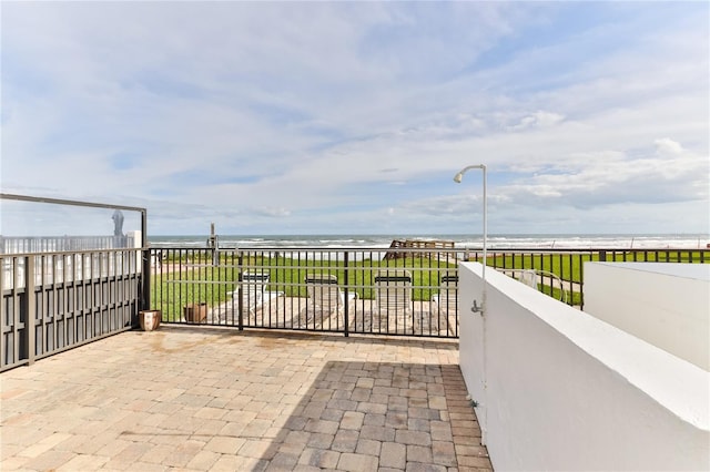 4875 S Atlantic Ave Unit E, New Smyrna Beach, FL 32169 - view of terrace with a balcony and a water view