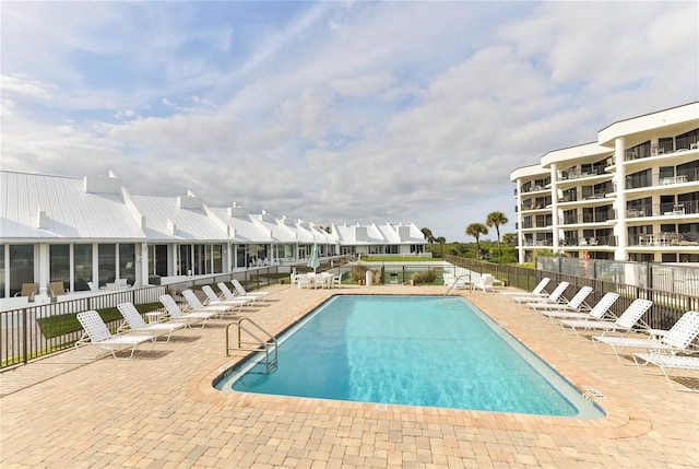 4875 S Atlantic Ave Unit E, New Smyrna Beach, FL 32169 - view of swimming pool with a patio area