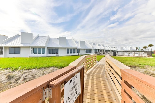 4875 S Atlantic Ave Unit E, New Smyrna Beach, FL 32169 - exterior space featuring a yard