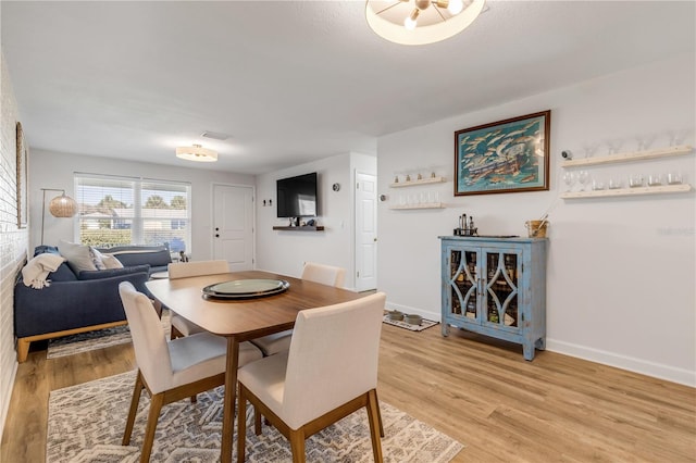 dining room with light hardwood / wood-style flooring