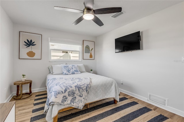 bedroom featuring light hardwood / wood-style floors and ceiling fan