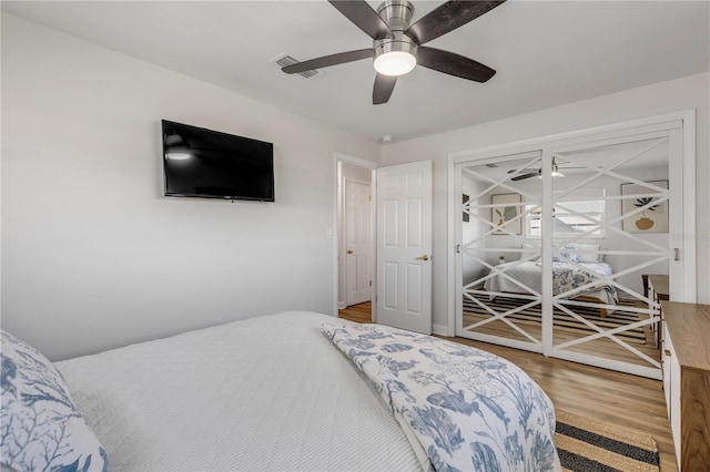 bedroom featuring light hardwood / wood-style floors and ceiling fan