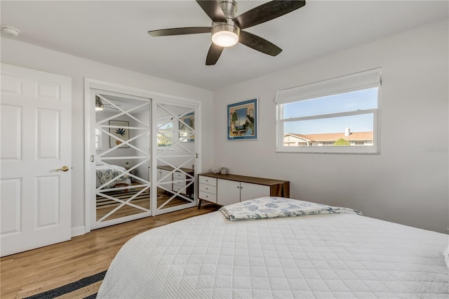 bedroom with ceiling fan and light wood-type flooring