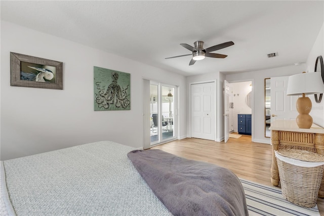 bedroom with light hardwood / wood-style flooring, ensuite bathroom, a closet, and ceiling fan