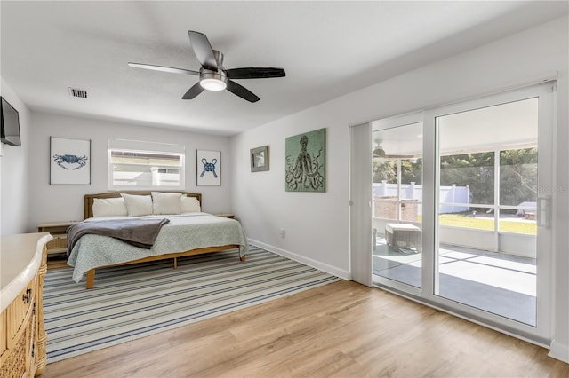 bedroom with ceiling fan, access to outside, and light wood-type flooring