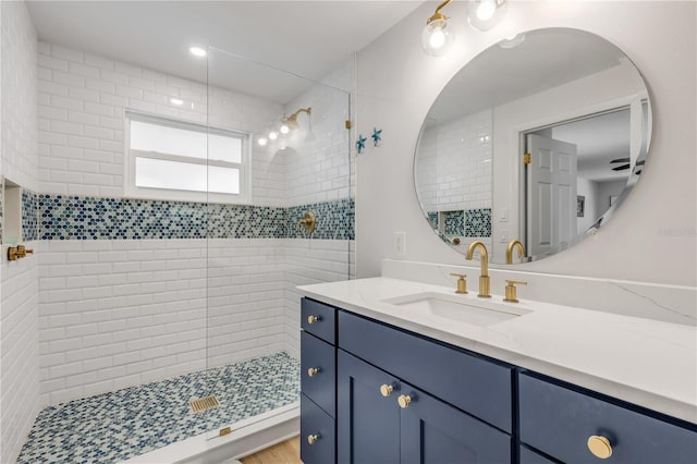 bathroom with an enclosed shower and vanity