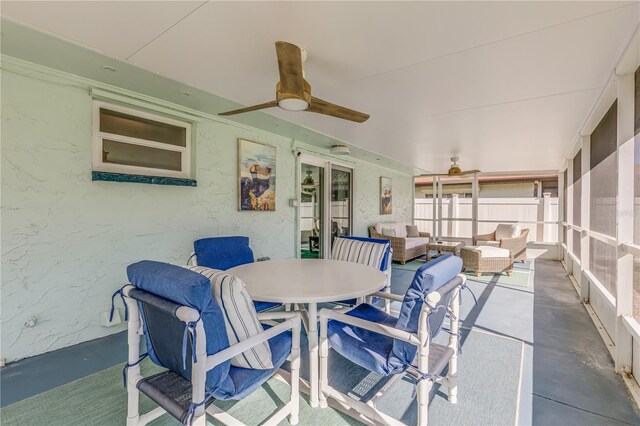 exterior space featuring outdoor lounge area and ceiling fan