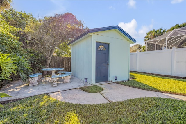 view of outdoor structure featuring a yard