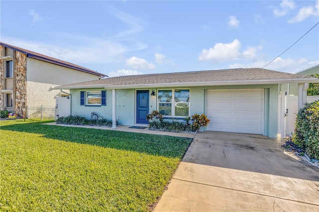 ranch-style home with a front lawn and a garage