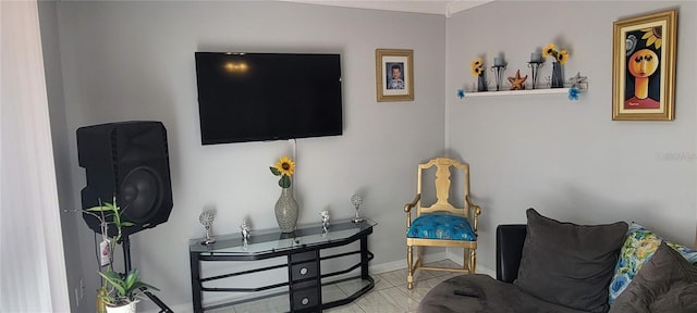 living area featuring baseboards and tile patterned floors