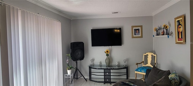 interior space with visible vents, crown molding, a textured ceiling, and baseboards