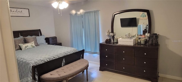 bedroom with ceiling fan and light tile floors