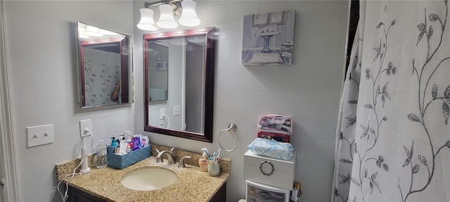 bathroom with vanity and a shower with shower curtain