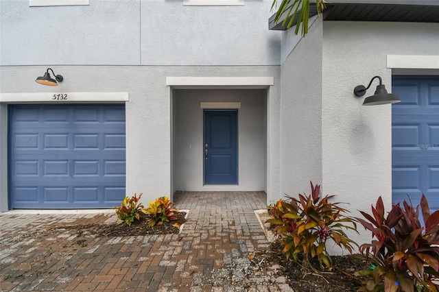 property entrance with a garage