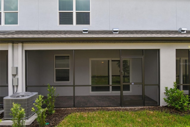 exterior space featuring central AC and a sunroom