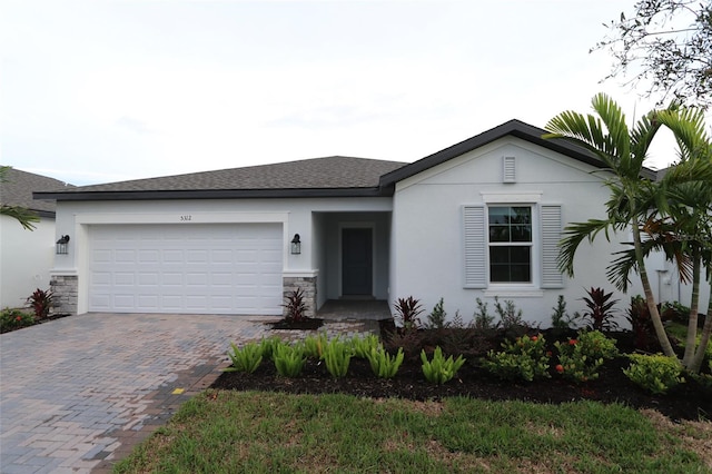 view of front of property with a garage