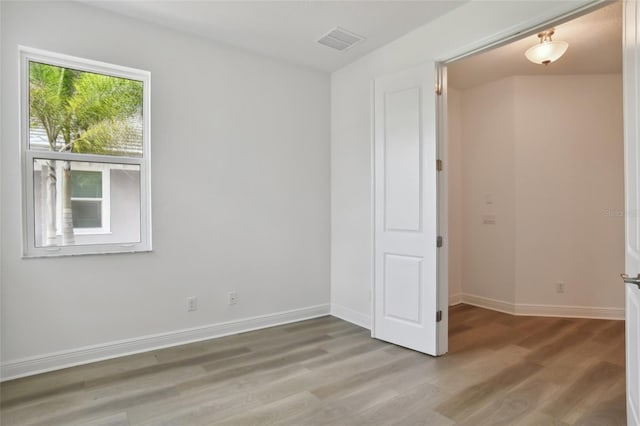 empty room with wood-type flooring