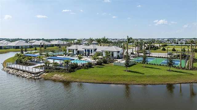 drone / aerial view with a water view and a residential view