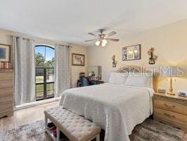 bedroom with ceiling fan and hardwood / wood-style floors