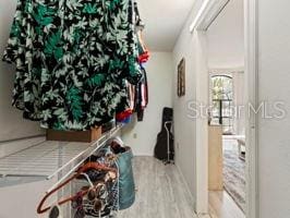 corridor featuring hardwood / wood-style flooring