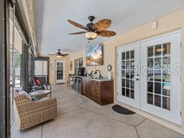 view of patio / terrace featuring french doors and an outdoor kitchen