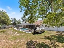 view of yard featuring a fenced in pool