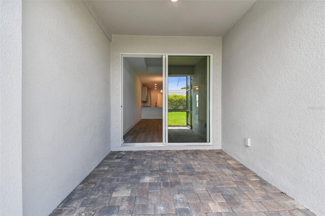 doorway to property with a patio