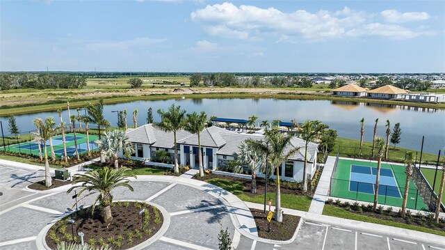 birds eye view of property with a water view