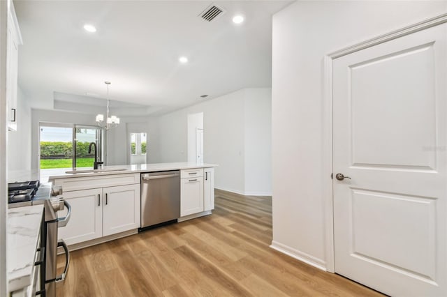 kitchen featuring sink, white cabinets, light wood-type flooring, and stainless steel appliances