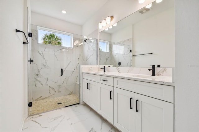 bathroom with double vanity, tile patterned flooring, and a shower with door