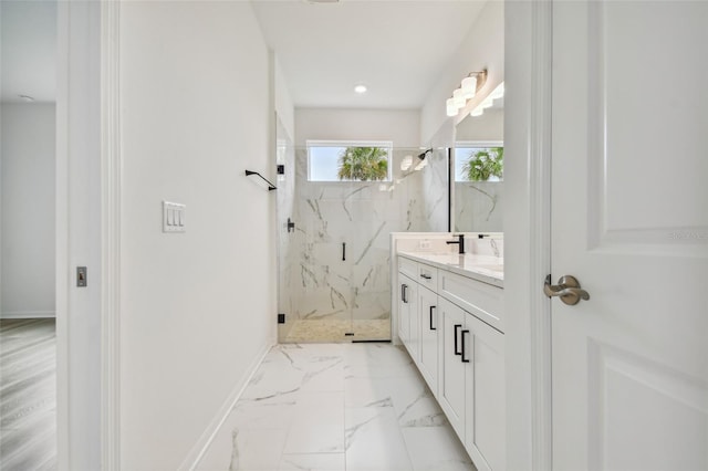 bathroom featuring vanity, tile patterned flooring, and a tile shower