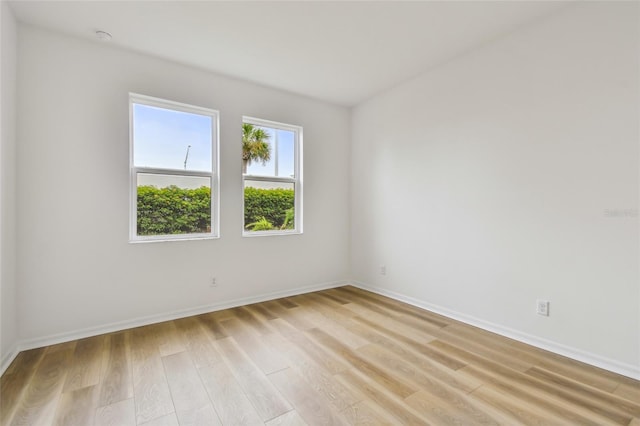 unfurnished room with light hardwood / wood-style floors