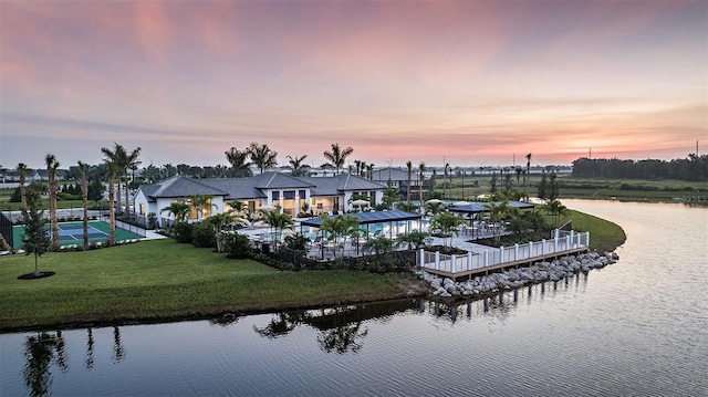 aerial view at dusk with a water view