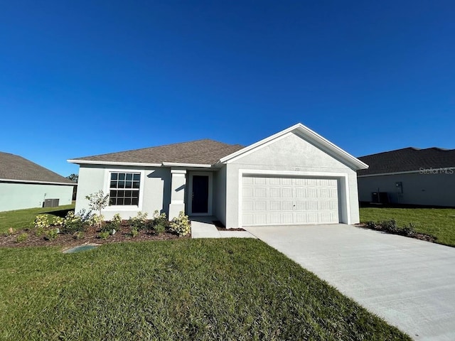 single story home with a front yard and a garage