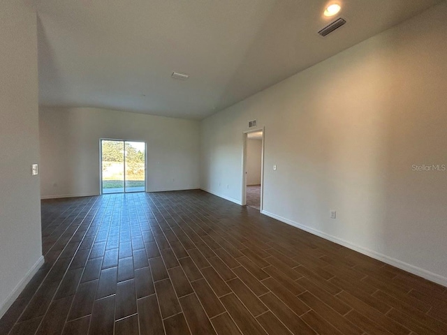 unfurnished room with dark hardwood / wood-style floors